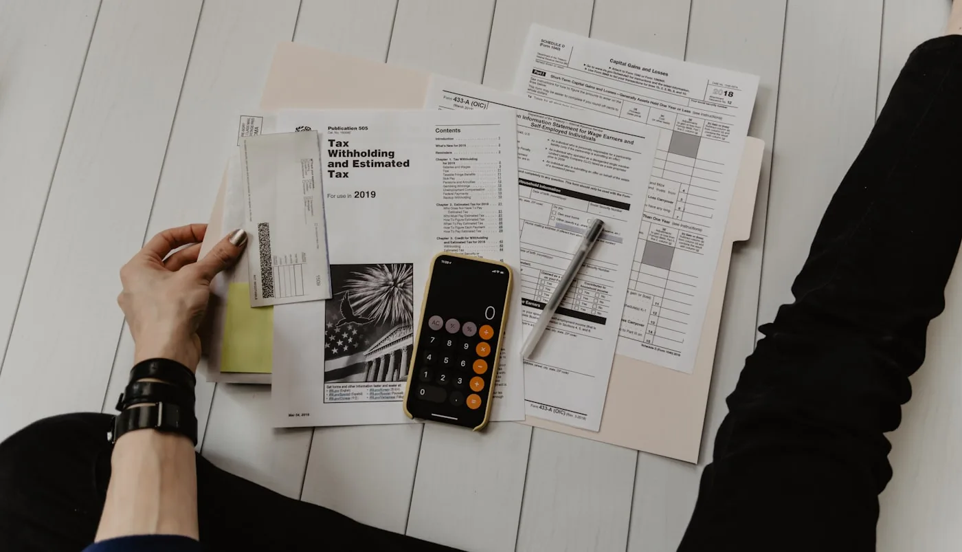 Bookkeeper reviewing financial records and reconciling accounts on screen