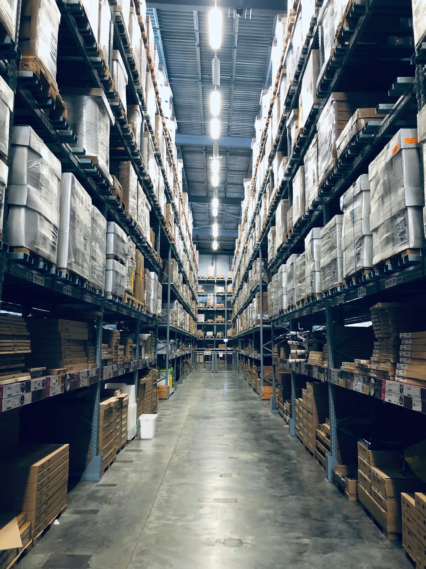 Warehouse aisles stacked with inventory for an online retail business